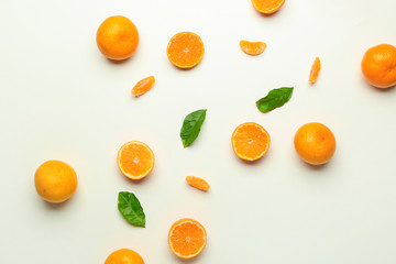 Ripe tasty tangerines on white background