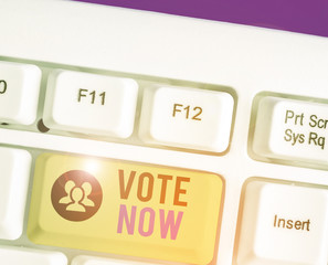 Conceptual hand writing showing Vote Now. Concept meaning formal indication of choice between two...