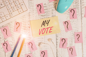 Word writing text My Vote. Business photo showcasing the act of showing your choice or opinion in an election or meeting Writing tools, computer stuff and scribbled paper on top of wooden table