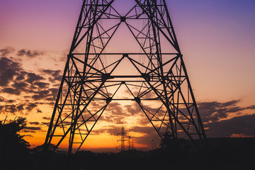 Hight voltage electric towers or pole  at sunset