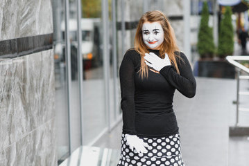 Portrait of a mime comedian. mime girl on the street