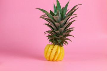 exotic tropical fruits, pineapple, starfruits isolated on a pink background
