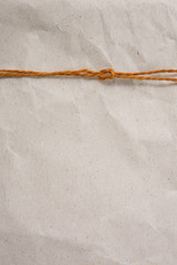 texture of grey crumpled paper with rope. background with a copy space