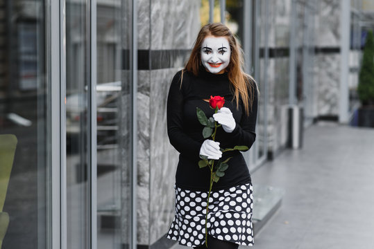woman mime with red rose