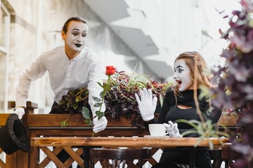 Mime on the street waiting to meet with his lover. Portrait of a mime comedian. mime on the street