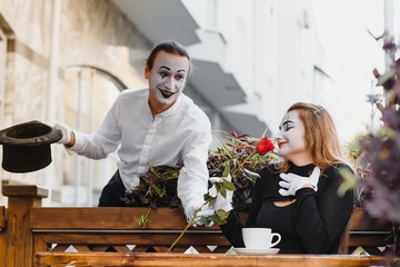 Mime on the street waiting to meet with his lover. Portrait of a mime comedian. mime on the street