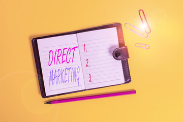 Conceptual hand writing showing Direct Marketing. Concept meaning business of selling products directly to the public Dark leather locked diary striped sheets marker colored background