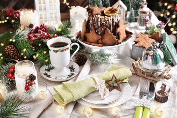 Christmas table setting with retro style decors and gingerbread ring cake