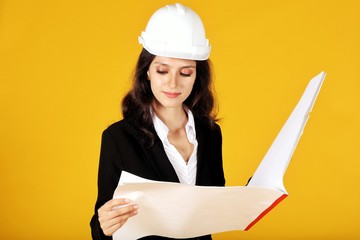 female architect holding blueprints