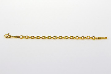 Gold hoop bracelet on a white background.