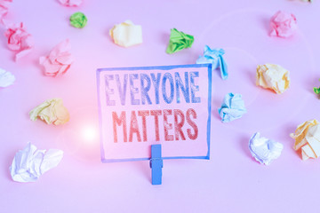 Word writing text Everyone Matters. Business photo showcasing everything that happens is part of a bigger picture Colored crumpled papers empty reminder pink floor background clothespin
