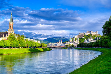 Naklejka premium A view of the Austrian city of Salzburg along the Salzach River.