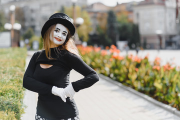 The girl with makeup of the mime. improvisation. mime shows different emotions