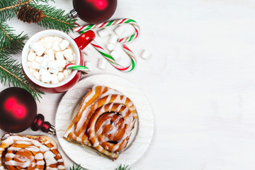 Fresh Sweet Homemade Cinnamon Rolls and cup of hot chocolate with marshmallow