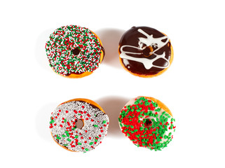 Sweet donuts with sprinkel on white background. Christmas donuts