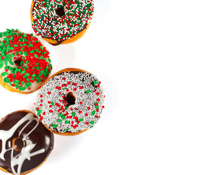 Sweet donuts with sprinkel on white background. Christmas donuts
