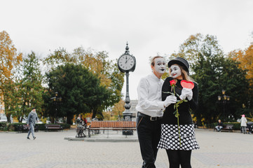 Mime on the street waiting to meet with his lover. Portrait of a mime comedian. mime on the street