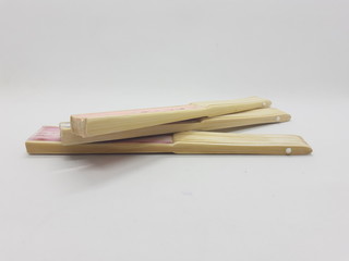 Artistic Colorful Ethnic Traditional Modern Design Hand Fan from Wood and Fabric Materials in White Isolated Background
