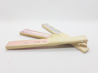 Artistic Colorful Ethnic Traditional Modern Design Hand Fan from Wood and Fabric Materials in White Isolated Background