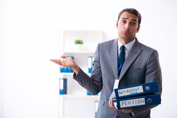 Young male accountant working in the office