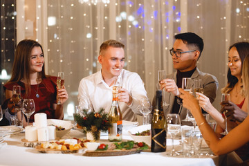 Friends at holiday table.