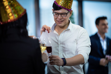Young business people have fun at a New Year's party 2020