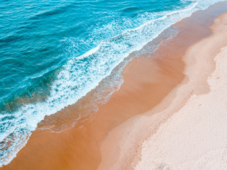 aqua waves with golden sand