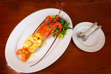 Baked Lobster on a white plate ,Luxury Seafood, Selective Focus of food.