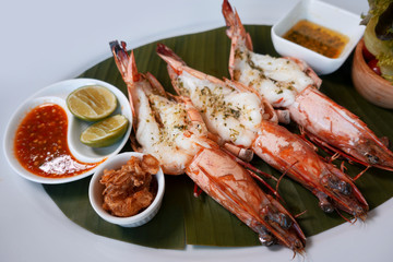 Grilled King prawns or shrimps with on white plate