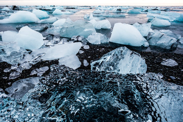 Diamond beach in Iceland on the Atlantic ocean coast. Icebergs from Jokulsarlon glacier lagoon