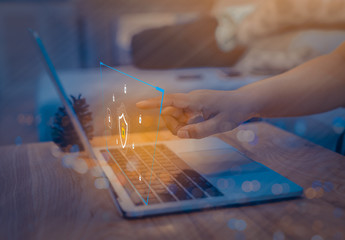 Businessman using a laptop computer with technology cybersecurity and privacy concept. protection and safe data for global network security.