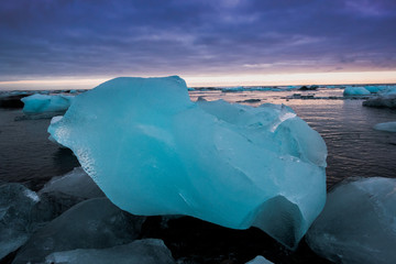 Diamond beach in Iceland on the Atlantic ocean coast. Icebergs from Jokulsarlon glacier lagoon