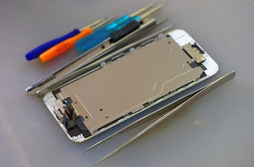 Repairing mobile phones and tablets by skilled technicians.Experienced testers and check mobile phones. Before and After RepairTools and equipment for repairing and unpacking mobile phones.