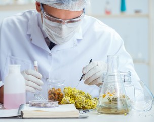 Chemist mixing perfumes in the lab