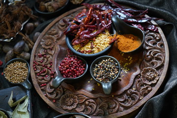 A variety spices and herbs in wooden bowls,  Of Asians For cooking.