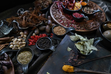 A variety spices and herbs in wooden bowls,  Of Asians For cooking.