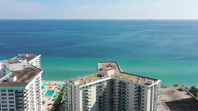 Aerial 4k footage heading to pristine beach in Miami Beach