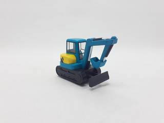 Obraz premium Photo Realistic Heavy Machinery Tractor Excavator Miniature Die Cast Toys Design for Souvenir Gift Collection Items in White Isolated Background 