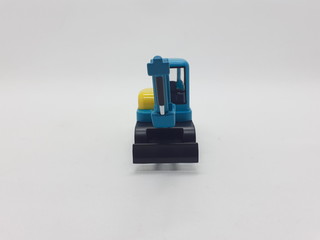 Fototapeta premium Photo Realistic Heavy Machinery Tractor Excavator Miniature Die Cast Toys Design for Souvenir Gift Collection Items in White Isolated Background 