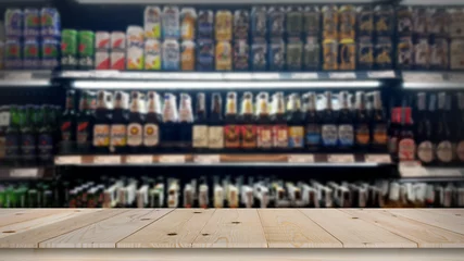 Deurstickers Abstract blur wine bottles on liquor alcohol shelves in supermarket background © photobuay