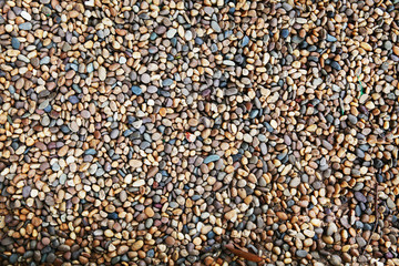 Sea stones background. Colorful small pebbles or stone in garden. Flat lay of sea stones texture background. Abstract shape pattern from nature.