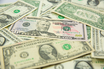Money american hundred dollar bills Pile of various currencies isolated on white background.Closeup of assorted American banknotes.US currency scattered on the table.america currency dollor currency.