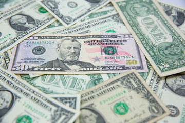 Money american hundred dollar bills Pile of various currencies isolated on white background.Closeup of assorted American banknotes.US currency scattered on the table.america currency dollor currency.