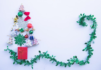 Christmas composition. Gifts, fir tree branches, red decorations on white background. top view, copy space