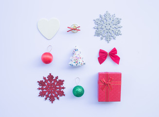 Christmas composition. Gifts, fir tree branches, red decorations on white background. top view, copy space