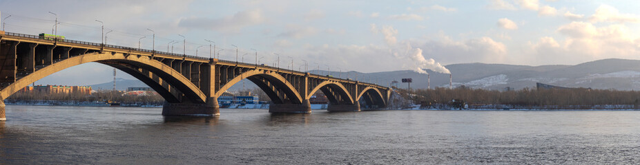 Fototapeta na wymiar city winter landscape, bridge, river, mountains