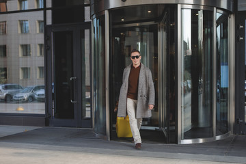 Man with a yellow suitcase.