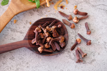 Cengkeh, clove on a wooden spoon.