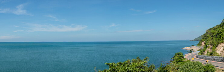 Panorama image of Beautiful Seascape Viewpoint of the roadway alongside with blue sea that is landmark at Kung Wiman Bay in Chanthaburi Province, Thailand.