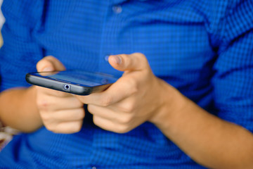 Fototapeta premium Using Smartphone. Close up of a human using mobile smart phone.